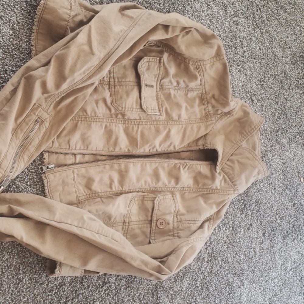 Maurice's tan bomber jacket